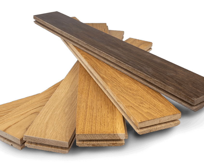 solid-parquet-strip-parquet-bembe-stacked-transparent Several stacked parquet strips in different wood species and shades—from light to dark oak
